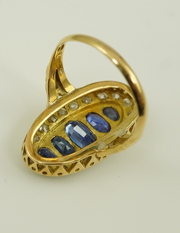 A late Victorian 18ct gold sapphire and diamond set oval cluster ring